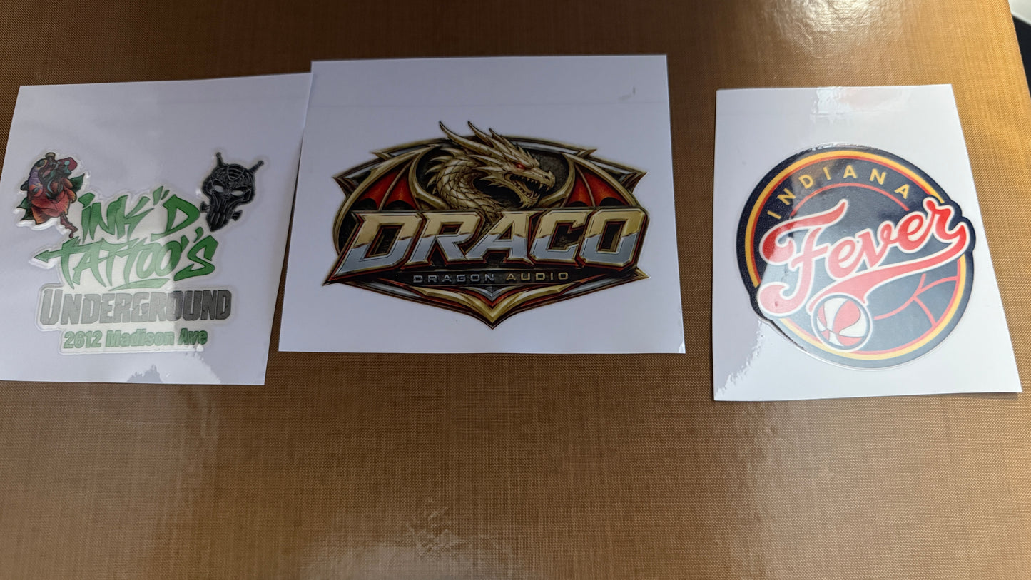 Custom gang sheets featuring vibrant designs: Underdog, Draco, and Indiana Fever logos.